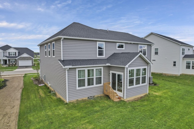 121 E Wind Rd, Delaware, OH 43015 - back of property featuring a lawn, cooling unit, roof with shingles, and entry steps