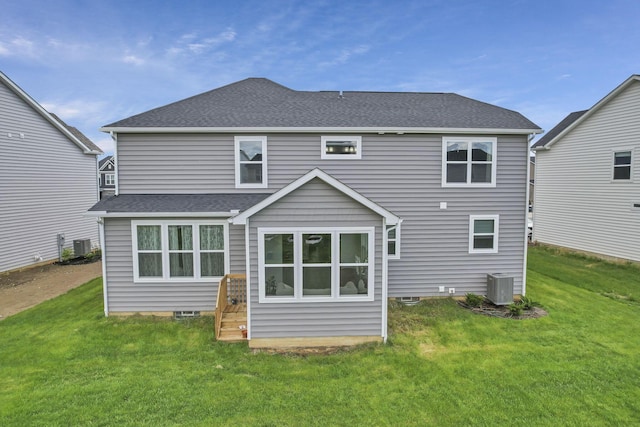 121 E Wind Rd, Delaware, OH 43015 - rear view of house with central AC unit, a yard, and a shingled roof