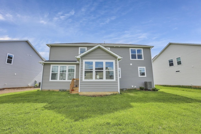 121 E Wind Rd, Delaware, OH 43015 - rear view of property with central AC unit and a lawn
