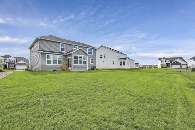 121 E Wind Rd, Delaware, OH 43015 - back of property featuring a lawn and entry steps