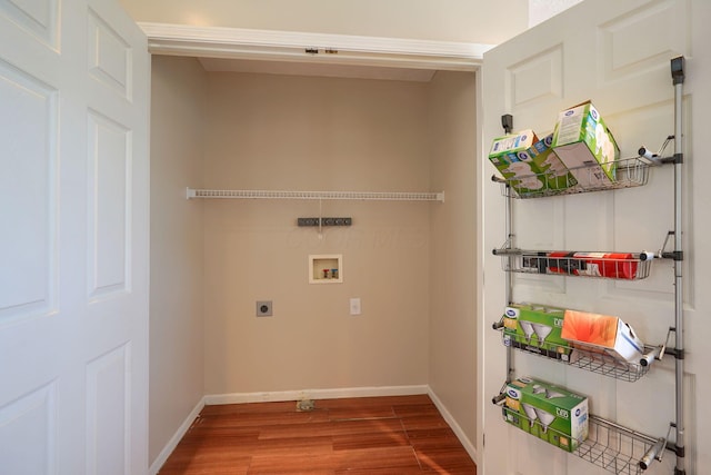 laundry area featuring washer hookup, electric dryer hookup, wood finished floors, and baseboards