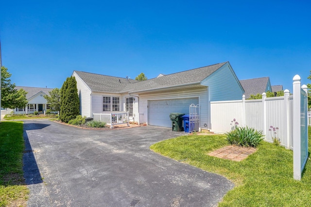 view of home's exterior featuring asphalt driveway and an attached garage