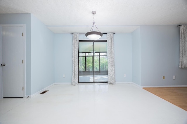 1418 Brookforest Dr, Columbus, OH 43204 - unfurnished dining area with a textured ceiling, visible vents, and baseboards