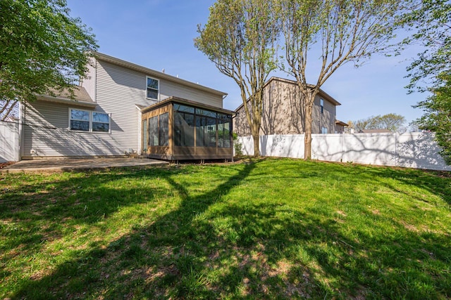 1418 Brookforest Dr, Columbus, OH 43204 - back of house with fence, a yard, and a sunroom