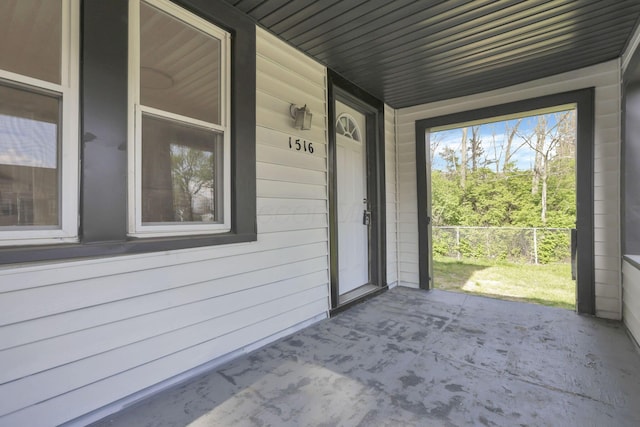 doorway to property featuring a porch