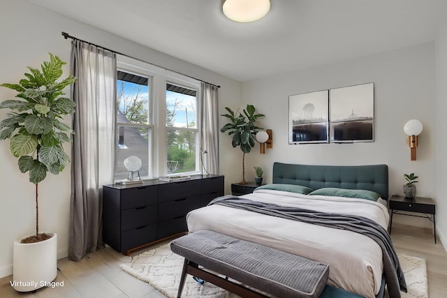 bedroom with light wood finished floors