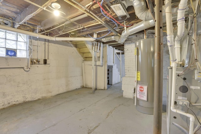 basement with visible vents and water heater