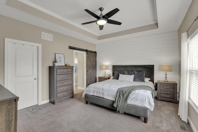 3884 Winding Oaks Dr, Columbus, OH 43228 - bedroom featuring crown molding, a barn door, a raised ceiling, carpet, and visible vents