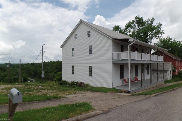 view of home's exterior featuring a balcony