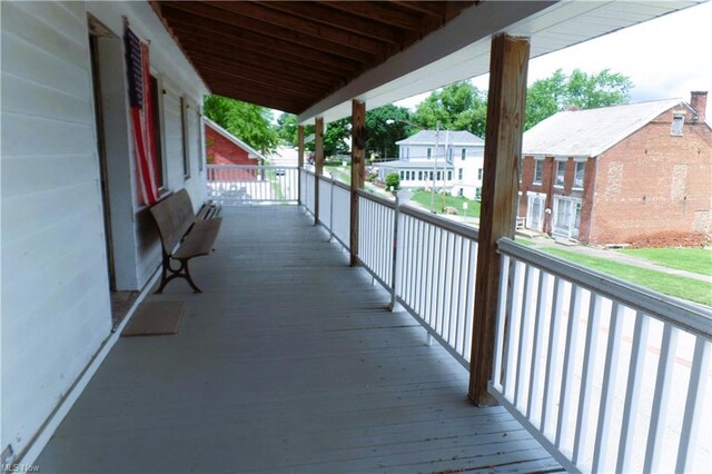 wooden terrace with a residential view