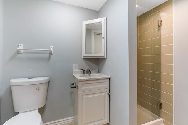full bath with vanity, toilet, and a shower stall