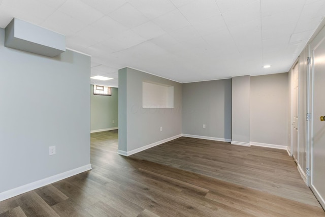 basement with recessed lighting, baseboards, and wood finished floors