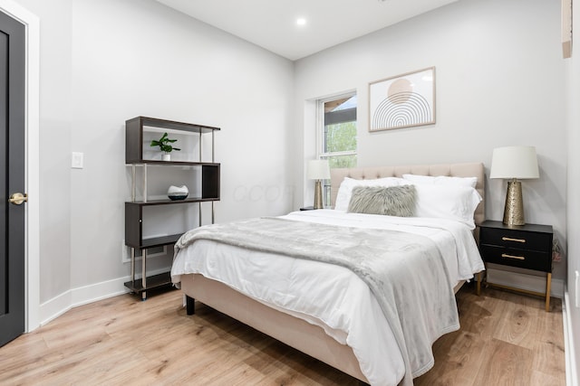 bedroom featuring recessed lighting, baseboards, and wood finished floors