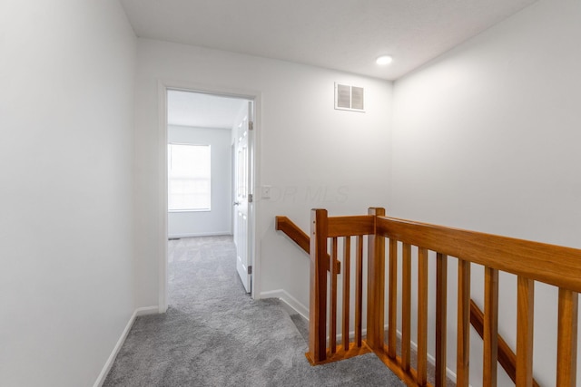 6516 Nottinghill Trail Dr, Canal Winchester, OH 43110 - hallway with carpet floors, an upstairs landing, visible vents, and baseboards