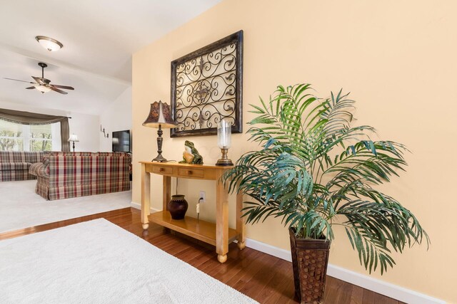 interior space with baseboards and wood finished floors