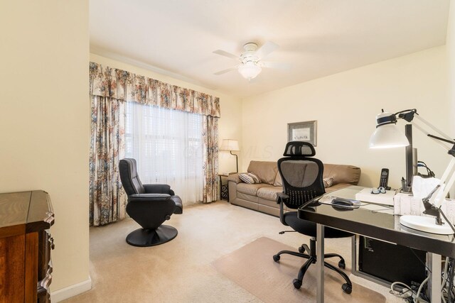 home office with carpet flooring and ceiling fan