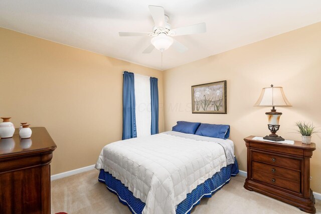 bedroom with baseboards, carpet, and ceiling fan
