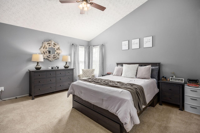 bedroom with a textured ceiling, a ceiling fan, vaulted ceiling, and light colored carpet