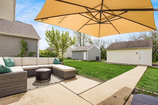 view of patio featuring an outdoor hangout area and an outbuilding