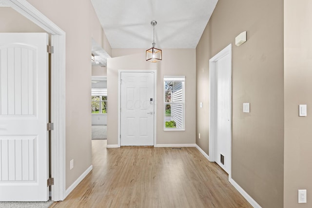 9222 Windy Creek Dr, Columbus, OH 43240 - foyer with light wood finished floors and baseboards