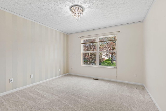 9222 Windy Creek Dr, Columbus, OH 43240 - unfurnished room featuring baseboards, an inviting chandelier, visible vents, and carpet
