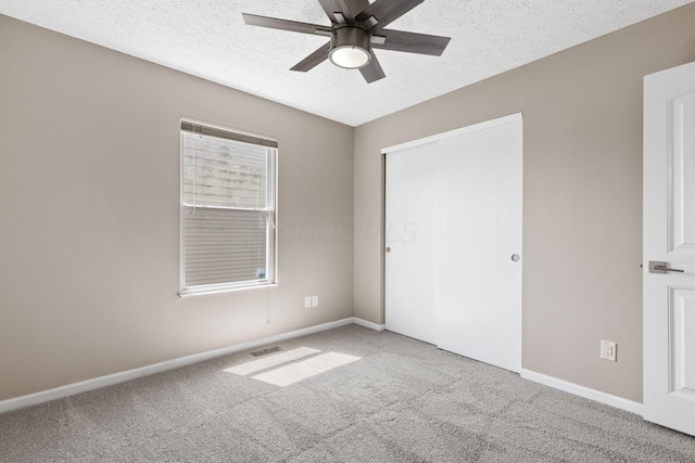 9222 Windy Creek Dr, Columbus, OH 43240 - unfurnished bedroom with a textured ceiling, a closet, carpet floors, baseboards, and visible vents