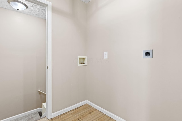 9222 Windy Creek Dr, Columbus, OH 43240 - laundry room with washer hookup, baseboards, electric dryer hookup, and laundry area