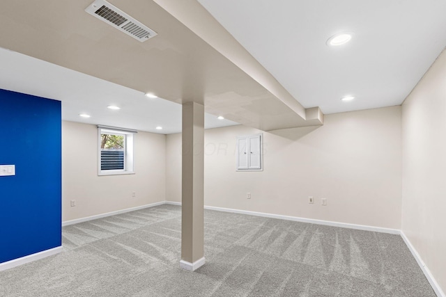 9222 Windy Creek Dr, Columbus, OH 43240 - below grade area featuring baseboards, visible vents, and carpet
