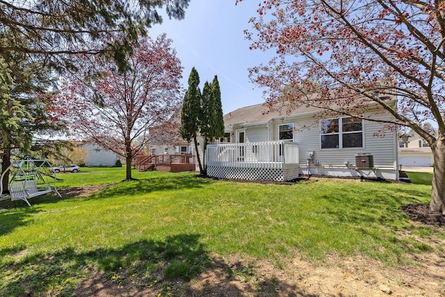 9222 Windy Creek Dr, Columbus, OH 43240 - back of property featuring a yard, central AC unit, and a deck