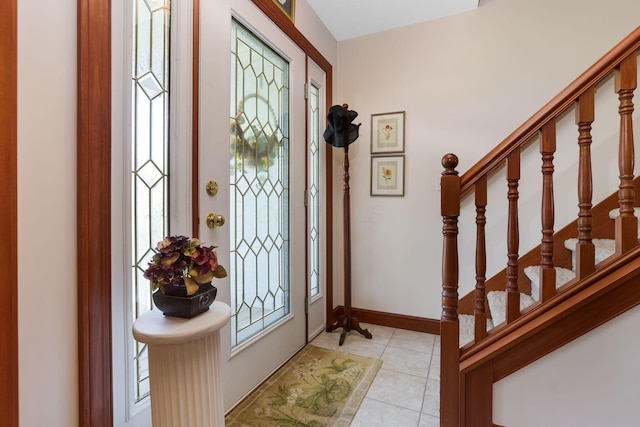 4690 Arrowhead Dr NW, Carroll, OH 43112 - foyer with light tile patterned floors, baseboards, and stairs