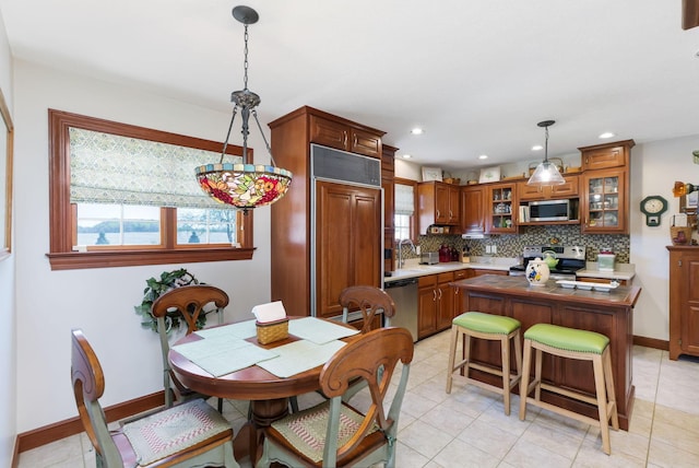 4690 Arrowhead Dr NW, Carroll, OH 43112 - dining space with baseboards, recessed lighting, and light tile patterned floors