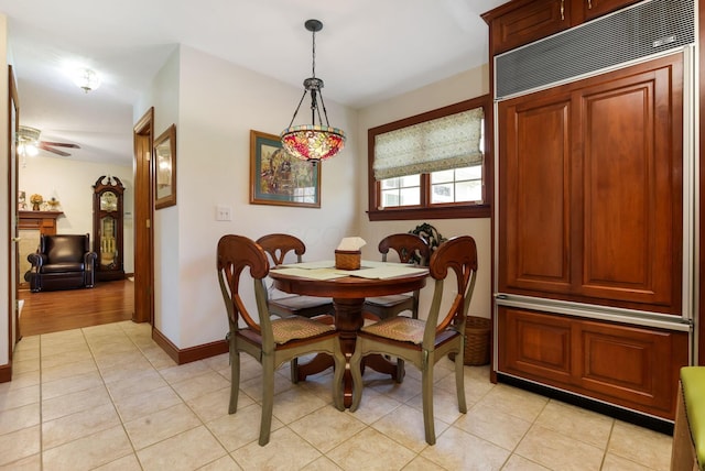 4690 Arrowhead Dr NW, Carroll, OH 43112 - dining area with light tile patterned flooring, a ceiling fan, and baseboards