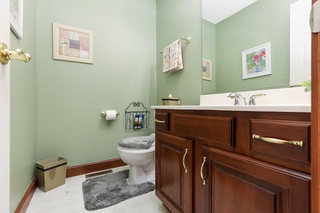 4690 Arrowhead Dr NW, Carroll, OH 43112 - bathroom with toilet, vanity, and baseboards