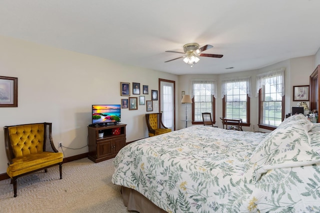 4690 Arrowhead Dr NW, Carroll, OH 43112 - bedroom with baseboards, light colored carpet, and a ceiling fan