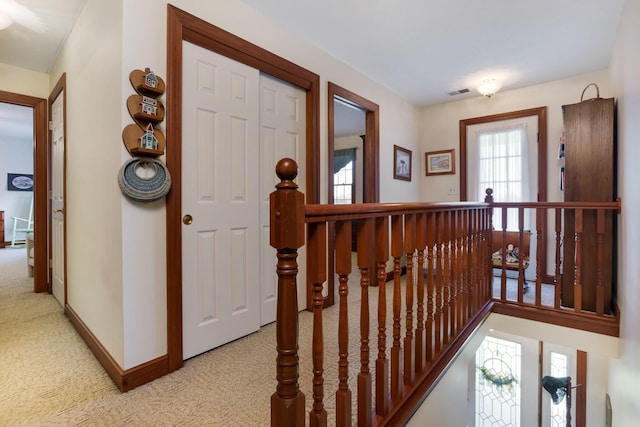 4690 Arrowhead Dr NW, Carroll, OH 43112 - corridor featuring an upstairs landing, light colored carpet, and baseboards