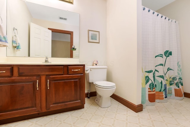 4690 Arrowhead Dr NW, Carroll, OH 43112 - full bathroom featuring toilet, tile patterned floors, vanity, and baseboards