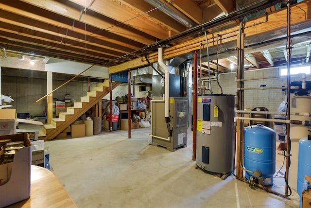 4690 Arrowhead Dr NW, Carroll, OH 43112 - unfinished basement featuring water heater, a water pressure tank, stairway, and heating unit