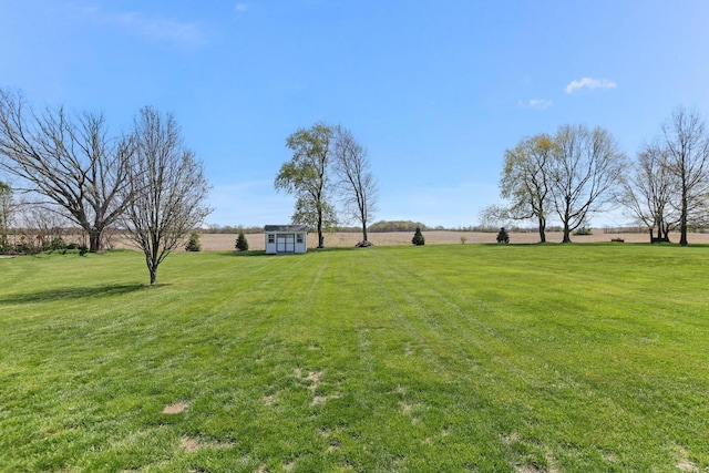 4690 Arrowhead Dr NW, Carroll, OH 43112 - view of green lawn with an outdoor structure, a shed, and a rural view