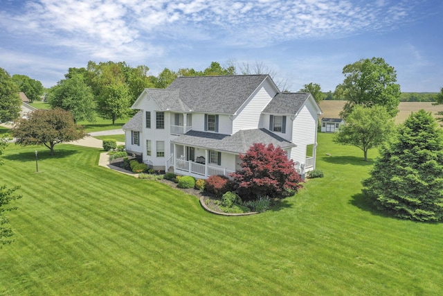 4690 Arrowhead Dr NW, Carroll, OH 43112 - view of front facade featuring covered porch, a shingled roof, and a front lawn