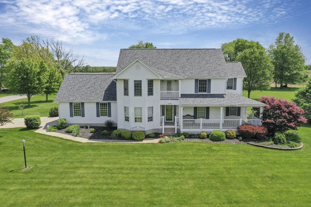 4690 Arrowhead Dr NW, Carroll, OH 43112 - view of front of home with a porch, a shingled roof, a front lawn, and a balcony