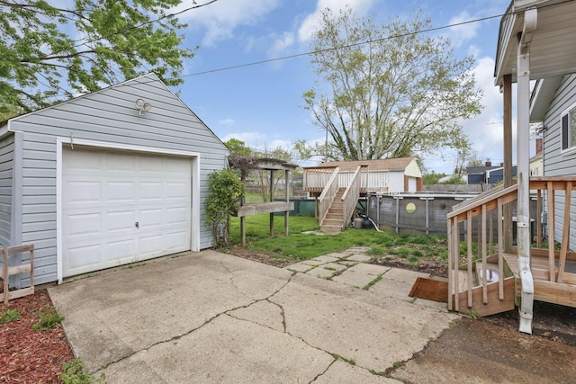 detached garage featuring driveway