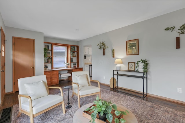 living area featuring visible vents and light wood-style floors