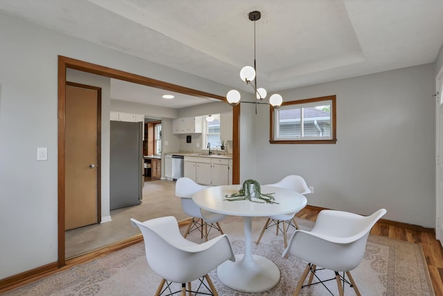 dining room featuring recessed lighting, baseboards, and light wood-type flooring