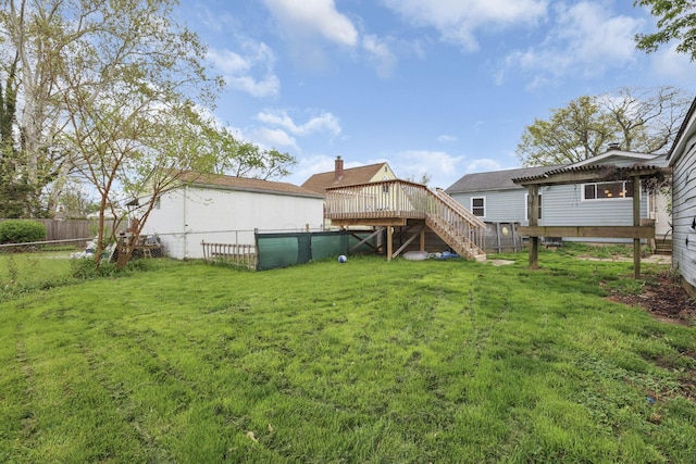 view of yard featuring a fenced backyard, a wooden deck, a pergola, and stairway