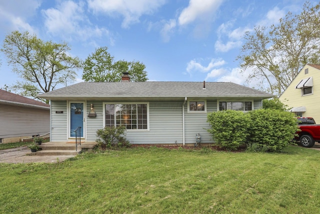 ranch-style home featuring a chimney, roof with shingles, and a front lawn
