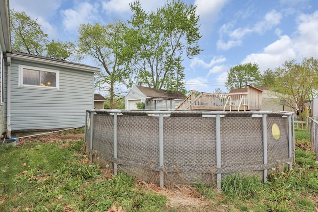 view of swimming pool with fence