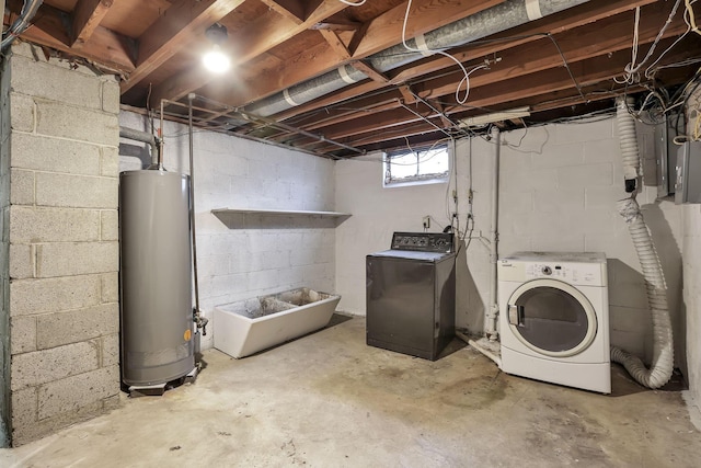 below grade area featuring gas water heater and washer and dryer