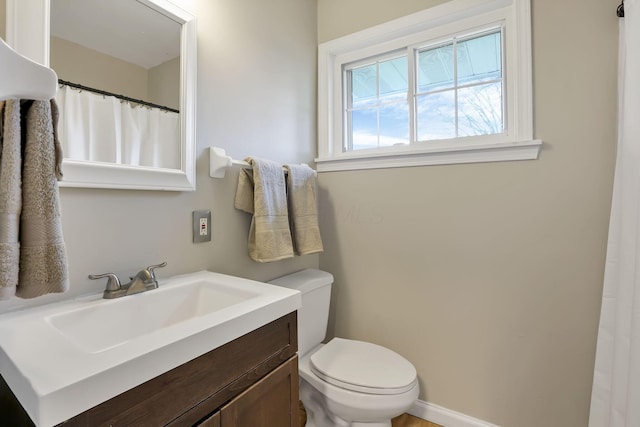 full bathroom with vanity and toilet