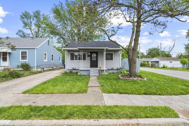 2728 Hiawatha St, Columbus, OH 43211 - bungalow featuring concrete driveway and a porch