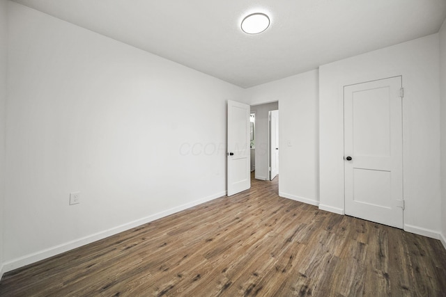 2728 Hiawatha St, Columbus, OH 43211 - unfurnished bedroom with wood finished floors and baseboards